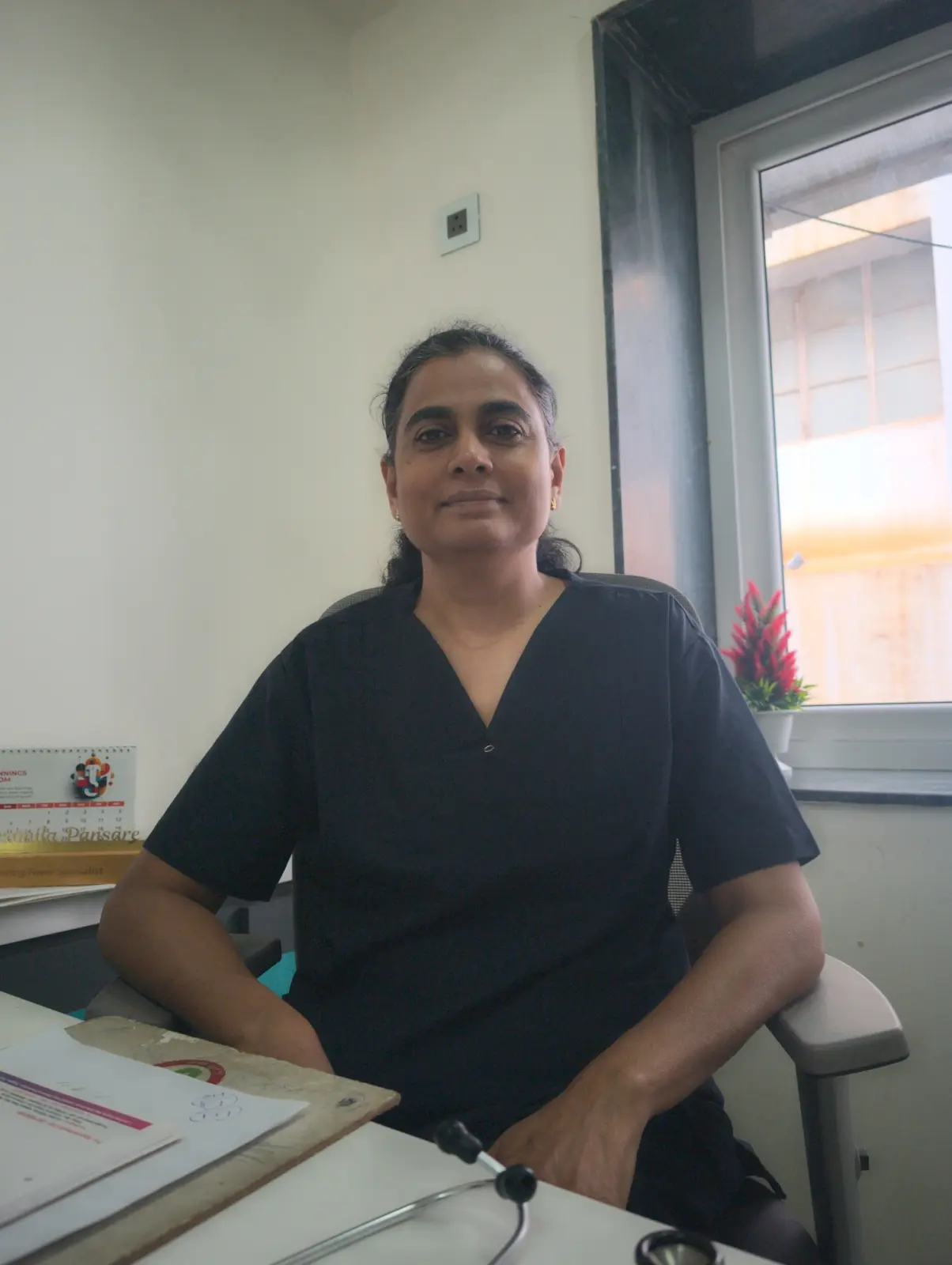 Dr. Pramila Sandeep Pansare at her consulting desk at the centre